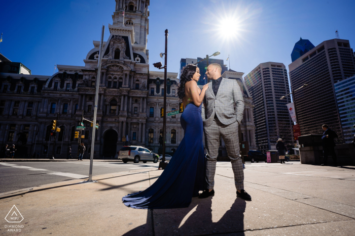 The couple is framed by the iconic architecture of Philadelphia City Hall, Pennsylvania, showcasing their effortless chemistry and romantic bond within the heart of the historic and bustling city.