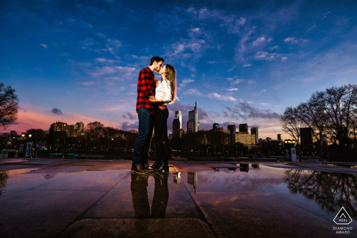 With beautiful reflections below and the city skyline above, the couple shares a quiet connection at the Philadelphia Museum of Art, capturing the grand essence of their Pennsylvania engagement.