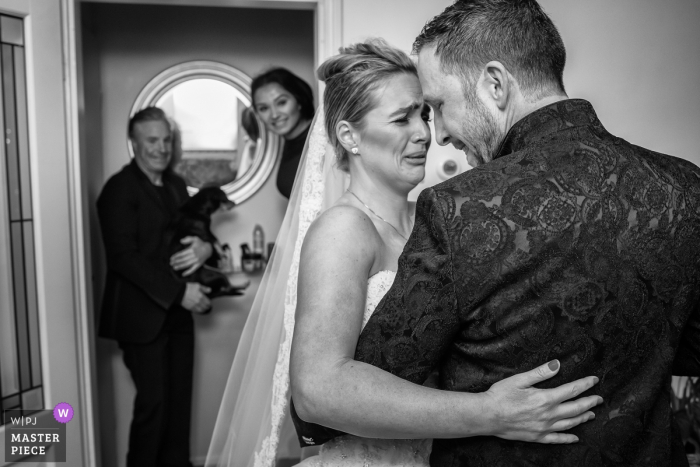 Photo by: <a href="https://www.wpja.com/contests/2018-v01-photography-competition/best-wedding-photographers/2166086">Peter Kos - Haarlem Noord Holland</a> Noord Hollands wedding photographer captured this emotional black and white photo of a bride ad groom embracing before the ceremony