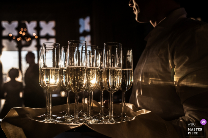 Photo by: <a href="https://www.wpja.com/contests/2018-v01-photography-competition/best-wedding-photographers/2166091">Peter Kos - Haarlem Noord Holland</a> Barneveld, The Netherlands wedding reception photo of drinks on servers tray at sunset.