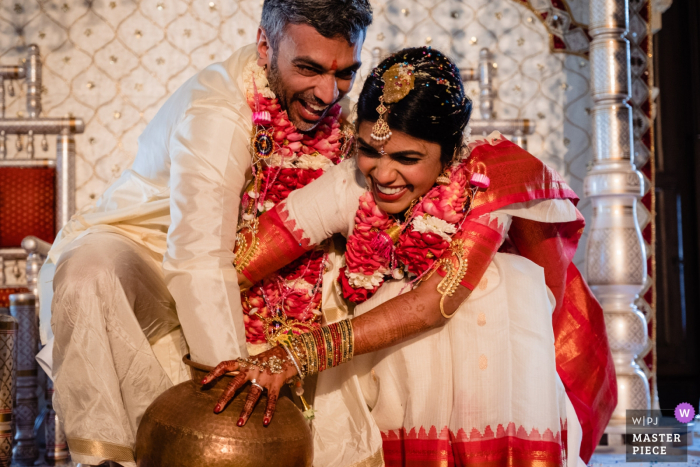 Bride and groom smile during the wedding reception at Julia Morgan Ballroom, San Francisco