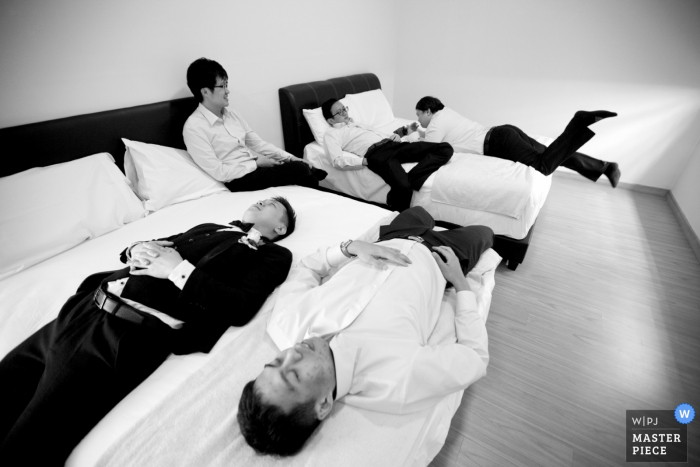 Photo by: <a href="https://www.wpja.com/contests/2018-v01-photography-competition/best-wedding-photographers/2167026">Chin Whei Tay - Malacca</a> Malaysia groomsmen and groom laying on the beds before the wedding