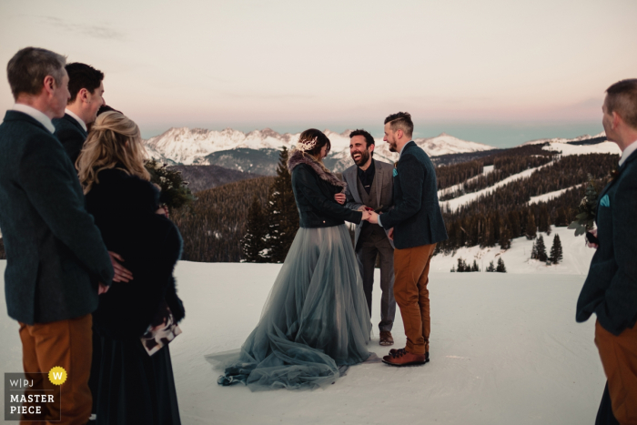 Photo by: <a href="https://www.wpja.com/contests/2018-v01-photography-competition/best-wedding-photographers/2167091">Graham Scobey - Denver Colorado</a> Vail, Colorado bridal party outside in the snow during the Mountain top wedding ceremony