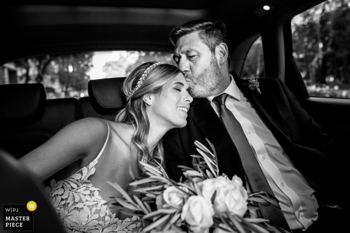 Photo by: <a href="https://www.wpja.com/contests/2018-v01-photography-competition/best-wedding-photographers/2167521">Andres Preumayr - Rosario Santa Fe</a> Rosario, Argentina brides father kisses her on the forehead in the car