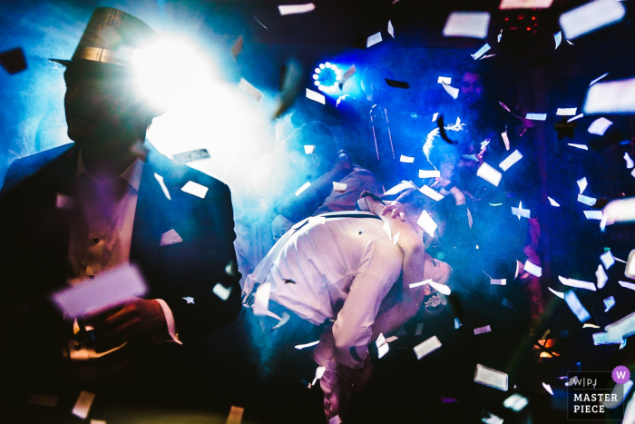 Photo by: <a href="https://www.wpja.com/contests/2018-v01-photography-competition/best-wedding-photographers/2171136">JD Land - Marlton New Jersey</a> New Jersey bride and groom dance and kiss with confetti flying everywhere at the reception