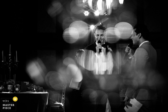 Photo by: <a href="https://www.wpja.com/contests/2018-v01-photography-competition/best-wedding-photographers/2171921">Chanarthip Cheingthong - Bangkok </a> Bangkok, Thailand groom and best man speaking with black-and-white bokeh