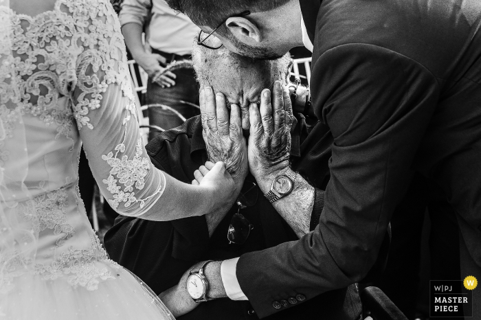 Photo by: <a href="https://www.wpja.com/contests/2018-v01-photography-competition/best-wedding-photographers/2173271">Vinicius Fadul - Campinas São Paulo</a> Campinas bride and groom hug man that is crying at the wedding ceremony