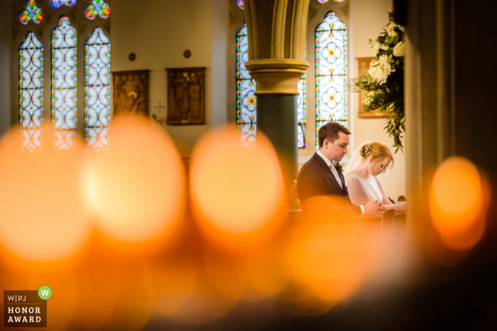 Photo by: <a href="https://www.wpja.com/contests/2018-v01-photography-competition/2173701">Nick Despres - Guernsey Guernsey</a> Guernsey Church wedding reportage photography - bride and groom at the altar