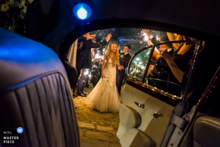 Photo by: <a href="https://www.wpja.com/contests/2018-v01-photography-competition/best-wedding-photographers/2174581">Annie Bang - Los Angeles California</a> San Miguel de Allende, Mexico bride and groom getting into the car at the reception outside