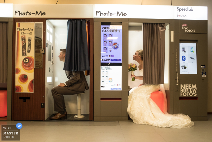 Photo by: <a href="https://www.wpja.com/contests/2018-v02-photography-competition/best-wedding-photographers/2178951">Peter Kos - Haarlem Noord Holland</a> Amsterdam bride and groom taking photos in separate photo booths