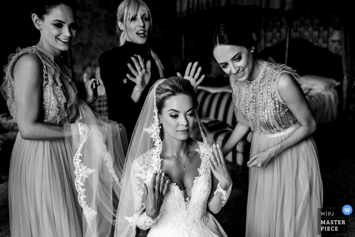 Kildare, Ireland bridesmaids smile with the bride in her dress in this pre-ceremony image Kildare, Ireland bridesmaids smile with the bride in her dress