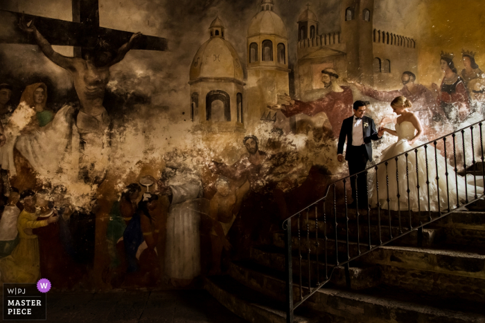 Photo by: <a href="https://www.wpja.com/contests/2018-v04-photography-competition/best-wedding-photographers/2188631">Isabelle Hattink - Rotterdam Zuid Holland</a> Mexico City bride and groom walk down the stairs at the wedding