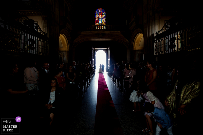Photo by: <a href="https://www.wpja.com/contests/2018-v06-photography-competition/best-wedding-photographers/2205696">Paulo Castro - Guimaraes </a> Picture of the bride and her father entering the church for the wedding ceremony in Braga, Portugal