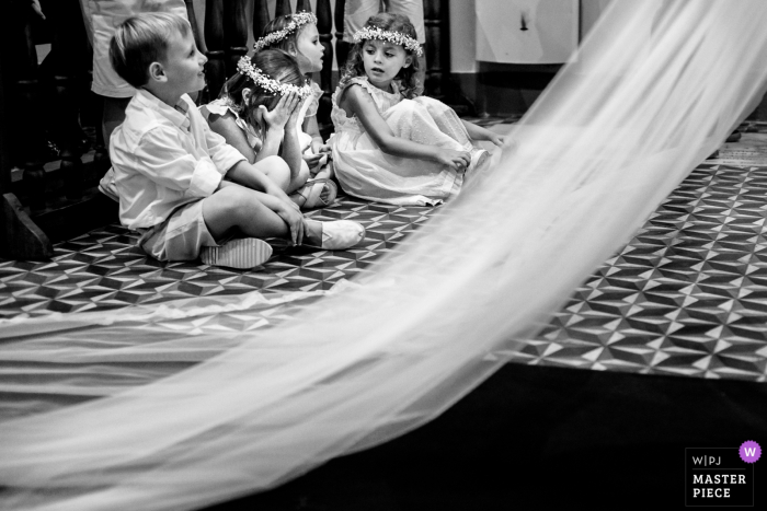 Photo by: <a href="https://www.wpja.com/contests/2018-v06-photography-competition/best-wedding-photographers/2211321">Andres Preumayr - Rosario Santa Fe</a> Rosario, Argentina kids sitting down next to the bride in her wedding dress before the wedding