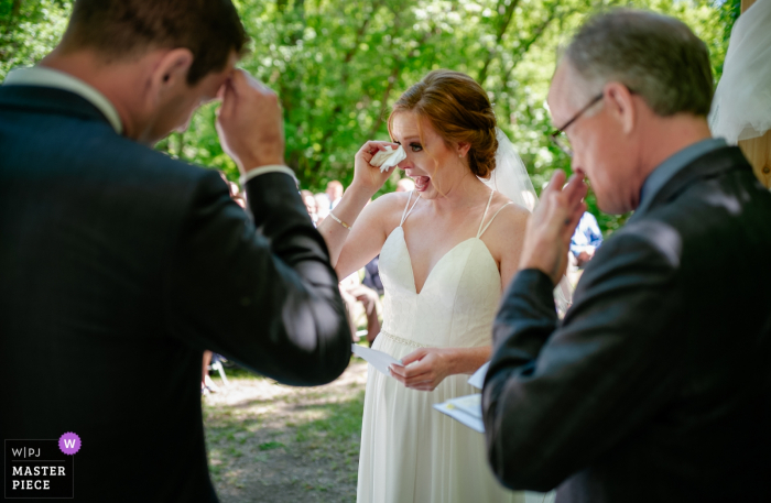 Photo by: <a href="https://www.wpja.com/contests/2018-v06-photography-competition/best-wedding-photographers/2214346">Dorota Karpowicz - Edmonton Alberta</a> Canada bride and groom get emotional during the wedding ceremony outside