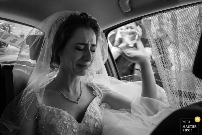 Photo by: <a href="https://www.wpja.com/contests/2018-v06-photography-competition/best-wedding-photographers/2214866">Erkin Agsaran - Kadikoy Istanbul</a> Tekirdag, Turkey bride gets emotional as she waves goodbye to guests after the wedding ceremony