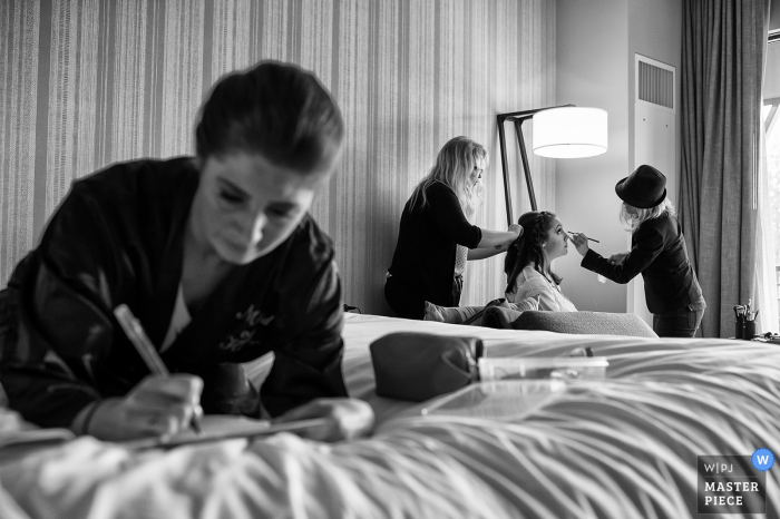 Photo by: <a href="https://www.wpja.com/contests/2018-v06-photography-competition/best-wedding-photographers/2215256">Matt Theilen - South Lake Tahoe California</a> Bridesmaids helping the bride get ready before the wedding at Lake Tahoe, NV