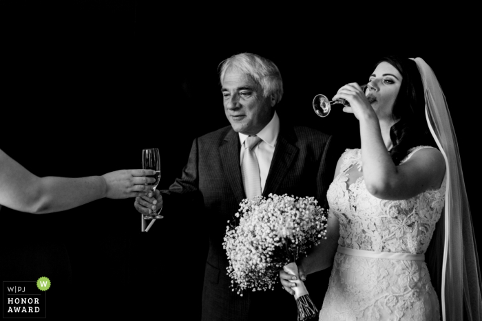 Wexford bride enjoying her drink at her Ireland wedding reception