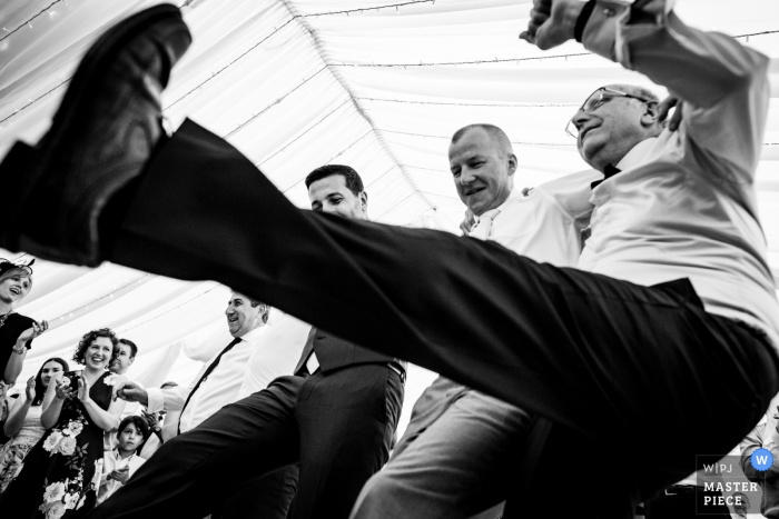 Photo by: <a href="https://www.wpja.com/contests/2018-v07-photography-competition/best-wedding-photographers/2230076">Emil Boczek - Wolverhampton West Midlands</a> Photo of guests and groom dancing together at the wedding reception in London, UK