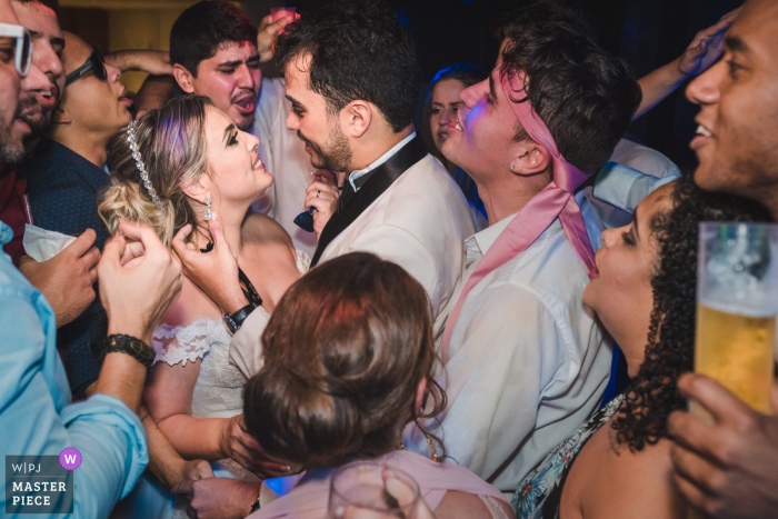 Bride and groom party with the guests at the wedding reception in Rio de Janeiro, Brazil