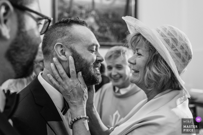 Photo by: <a href="https://www.wpja.com/contests/2018-v08/best-wedding-photographers/2234491">Sergio Cueto - Alcala de Henares Madrid</a> Candeleda groom smiles as his mother hugs him after the wedding