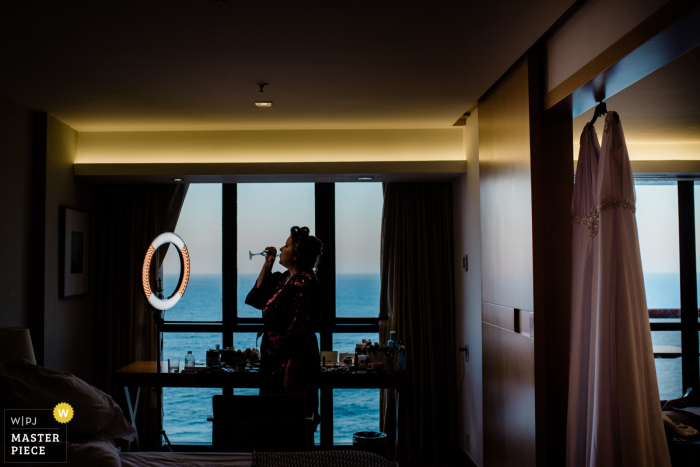the Bride enjoys a drink Bride enjoys a drink before the wedding ceremony in Rio de Janeiro