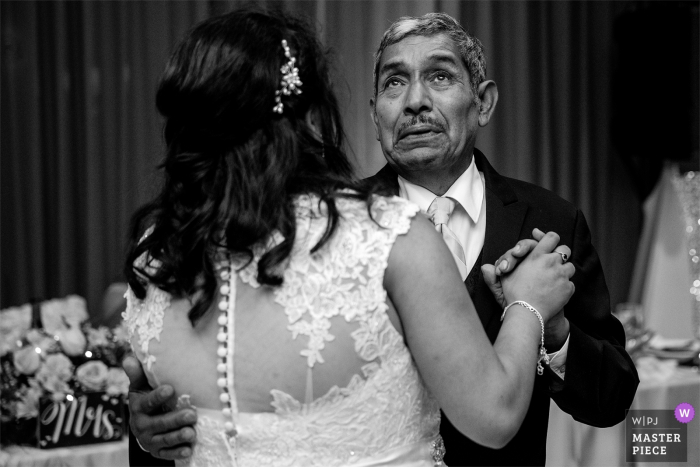 Brides father gets emotional while dancing with her at the wedding reception at the Atlantis Casino Reno, NV