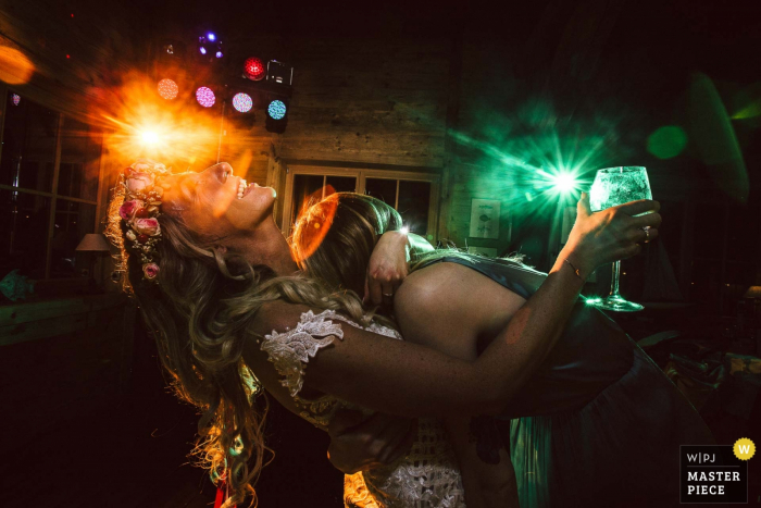 Bride dances with maid of honor at the wedding reception in Gerber Bootshaus Uhingen
