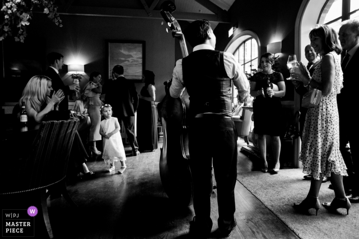 Kildare Wedding Photojournalism of a Live bass musician at the wedding reception party Kildare Wedding Photojournalism | Live bass musician at the wedding reception party