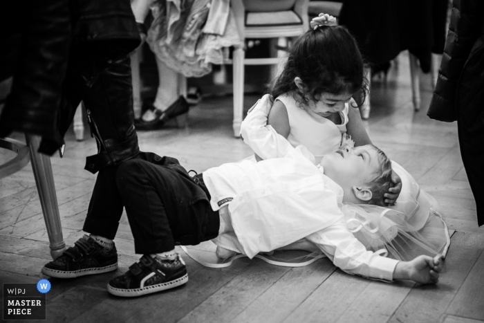 Photo by: <a href="https://www.wpja.com/contests/2018-v13/best-wedding-photographers/2282896">Vincent Bourrut - La Neuveville Bern</a> Les Rasses, Switzerland Wedding Photojournalist | the ring bearer and flower girl Play on the floor together at the reception