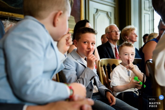Photo by: <a href="https://www.wpja.com/contests/2018-v13/best-wedding-photographers/2283106">Ingeborg van Bruggen - Oud-Beijerland Zuid Holland</a> Zuid Holland Wedding Photojournalist | shhhhh.... The boys are trying to be quiet during the indoor wedding ceremony