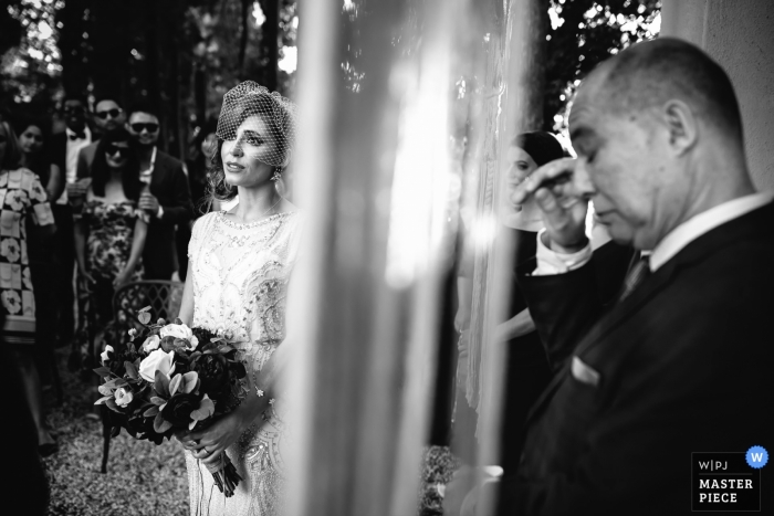Photo by: <a href="https://www.wpja.com/contests/2018-v13/best-wedding-photographers/2287196">Julian Kanz - Portofino Genova</a> Portofino Wedding Photojournalist | the bride waits during the ceremony in this black-and-white photo
