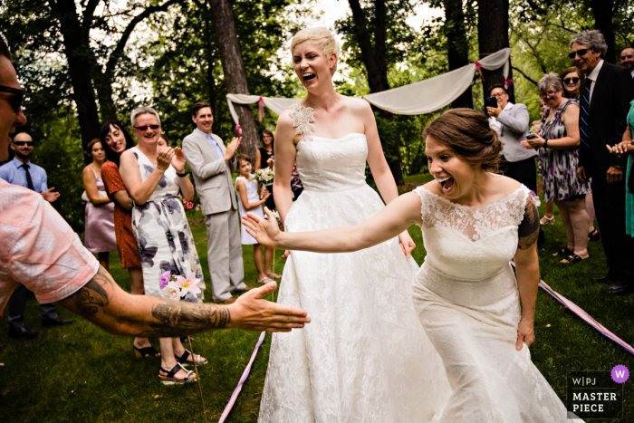Winnipeg, Manitoba, Canada outdoor wedding ceremony celebration high-fives Winnipeg, Manitoba, Canada outdoor wedding ceremony celebration high-fives