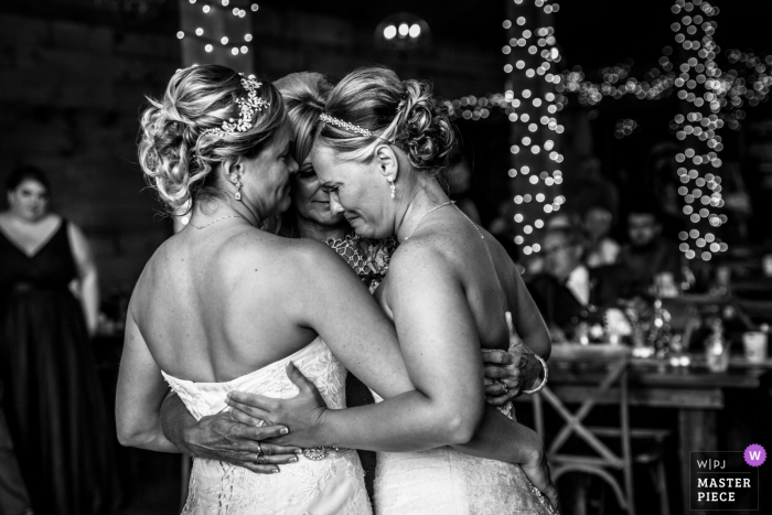 Minnesota wedding reception hugs on the dance floor.