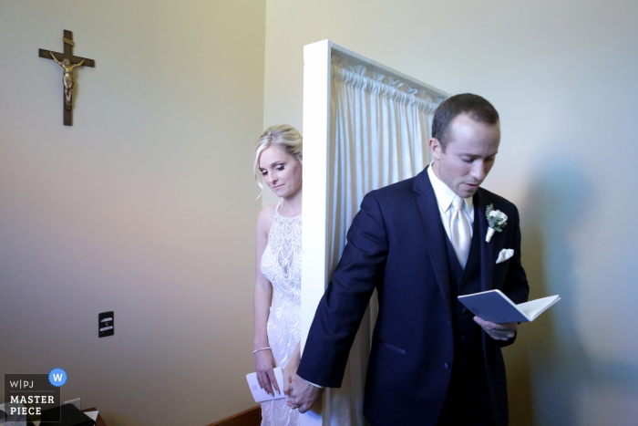 Photo by: <a href="https://www.wpja.com/contests/2018-v14/best-wedding-photographers/2297941">Megan Resch - Louisville Kentucky</a> Indiana Wedding Photojournalist | the bride and groom hold hands and read cards from each other before the ceremony