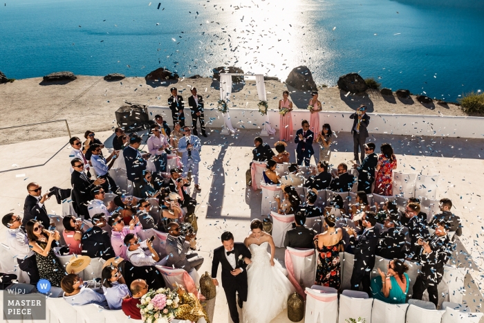 Photo by: <a href="https://www.wpja.com/contests/2018-v15/best-wedding-photographers/2308211">Panayis Chrysovergis - London London</a> The end of this grace wedding ceremony overlooking the Sea - the couple walks out to blasts of confetti