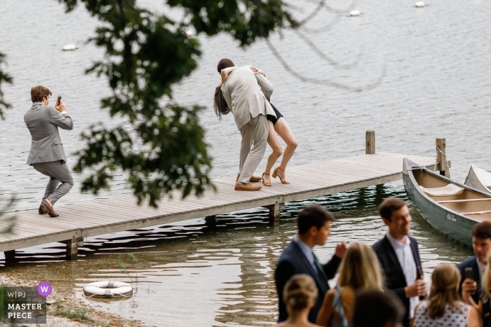 Photo by: <a href="https://www.wpja.com/contests/2018-v15/best-wedding-photographers/2312556">Alex Paul - Boston Massachusetts</a> Plymouth wedding photo of a gentleman dipping a woman on a boat dock | wedding photograph from Ma