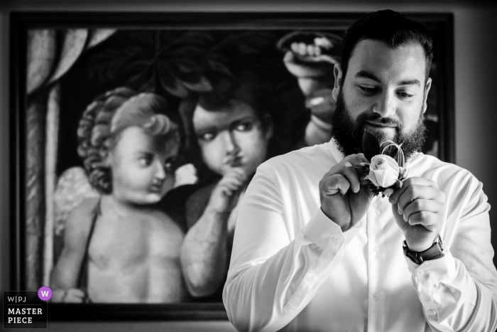 Photo by: <a href="https://www.wpja.com/contests/2018-v15/best-wedding-photographers/2319166">Alan Fresnel - Playa del Carmen Quintana Roo</a> Wedding photojournalism at Playa del Carmen - groom figuring out how to pin his boutonniere