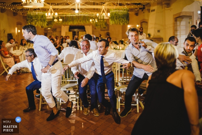 Photo by: <a href="https://www.wpja.com/contests/2018-v16/best-wedding-photographers/2329106">Daniel Monteiro - Porto </a> Porto wedding photograph of reception games for the guests - musical chairs?