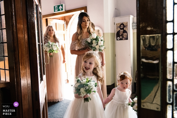 Photo by: <a href="https://www.wpja.com/contests/2018-v17/best-wedding-photographers/2342766">Lukas Powroziewicz - Edinburgh Midlothian</a> Holy Cross Church, Glasgow photo showing the bridal party entering for the wedding ceremony