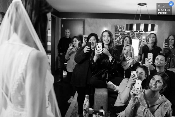 Photo by: <a href="https://www.wpja.com/contests/2018-v18/best-wedding-photographers/2361866">Candice C. Cusic - Chicago Illinois</a> Loews Chicago Hotel wedding photo | Bride reveal to bridesmaids