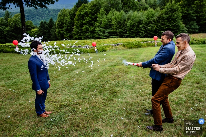 Burlington wedding photo humor | wedding photo of confetti canon blast to the face