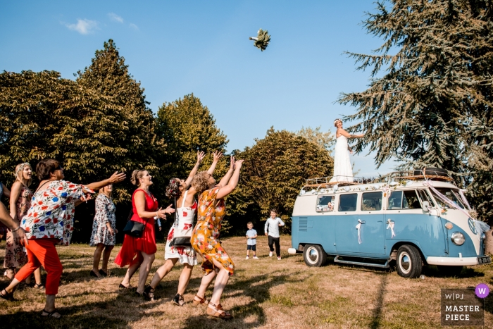 Photo by: <a href="https://www.wpja.com/contests/2018-v19/best-wedding-photographers/2368336">Cedric Derbaise - Bury </a> Wedding Bouquet toss from VW van by Oise photographer