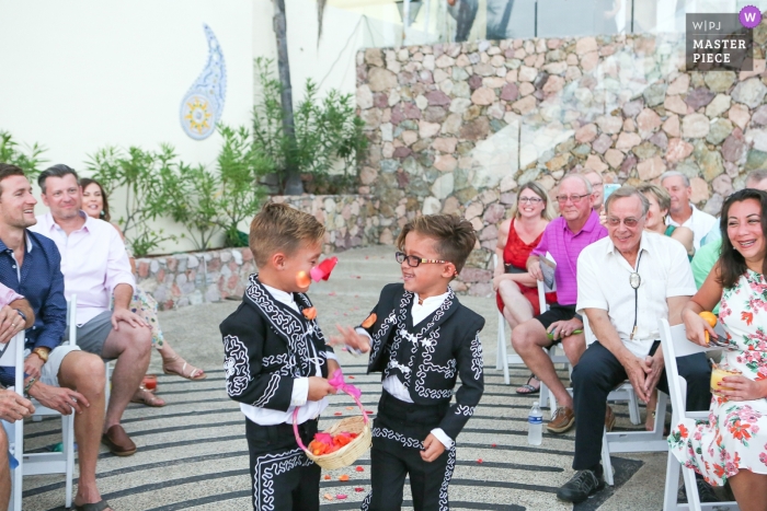 Photo by: <a href="https://www.wpja.com/contests/2018-v19/best-wedding-photographers/2372451">Megan Resch - Louisville Kentucky</a> flower boys or ring bearers having a flower fight | kids at weddings in puerto vallarta, mexico