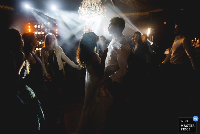 Photo by: <a href="https://www.wpja.com/contests/2018-v19/best-wedding-photographers/2374371">Simon Cassanas - Paris </a> Wedding pictures from a well lit reception dance party by Paris photographer - Île-de-France wedding photography