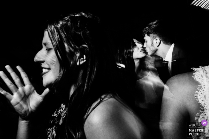 Photo by: <a href="https://www.wpja.com/contests/2018-v19/best-wedding-photographers/2378956">Rocio Vega Roa - Ponferrada Leon</a> Wedding shoot with Leon couple kissing at reception
