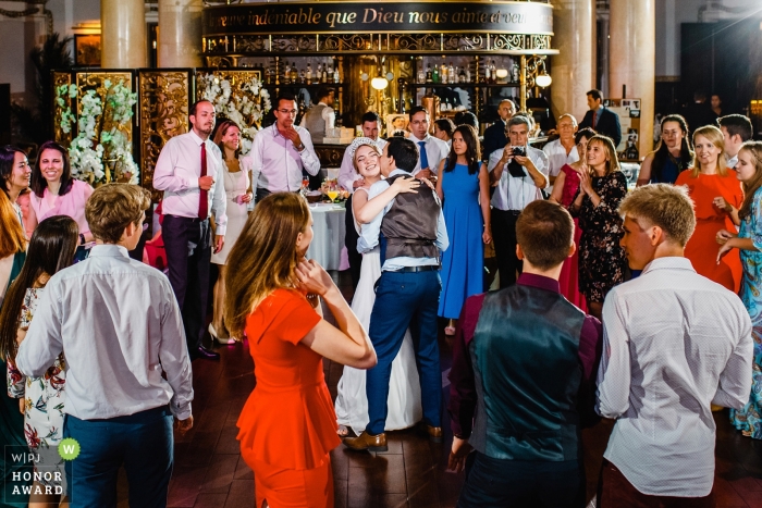 Photo by: <a href="https://www.wpja.com/contests/2018-v19-photography-competition/best-wedding-photographers/2379156">Artem Pitkevich - Saint-Petersburg </a> Saint-Petersburg wedding shoot with a couple dancing on crowded dance floor with guests