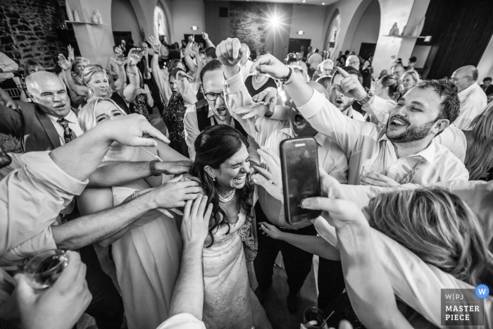 Photo by: <a href="https://www.wpja.com/contests/2018-v19/best-wedding-photographers/2379461">Danette Pascarella - Clinton New Jersey</a> New Jersey wedding shoot with a bride surrounded by guests