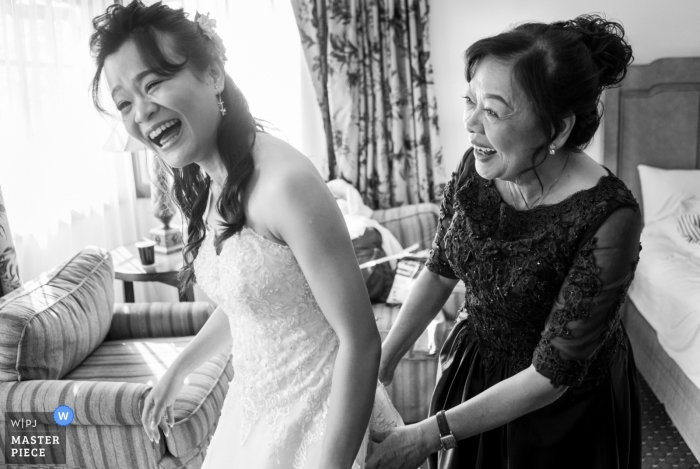 Photo by: <a href="https://www.wpja.com/contests/2018-v19/best-wedding-photographers/2380106">Joshua Grasso - Buford Georgia</a> Mother of the bride sharing a laugh before an Atlanta wedding