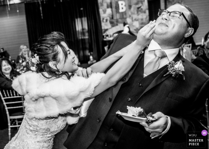 Photo by: <a href="https://www.wpja.com/contests/2018-v19/best-wedding-photographers/2380126">Joshua Grasso - Buford Georgia</a> Wedding photojournalism reception cake smash for groom in Atlanta - Almost got him